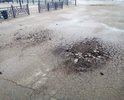 Асфальт меняли не так давно.                      Но небыло проведено земляных работ - подготовка дорожной подушки, дренаж. Асфальт вспучивает и крошит, слой явно тонкий.