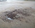 Асфальт меняли не так давно.                      Но небыло проведено земляных работ - подготовка дорожной подушки, дренаж. Асфальт вспучивает и крошит, слой явно тонкий.