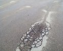 Асфальт меняли не так давно.                      Но небыло проведено земляных работ - подготовка дорожной подушки, дренаж. Асфальт вспучивает и крошит, слой явно тонкий.