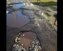 Добрый день, по адресу Дорожная 25, Нефтекамск, практически полностью отсутствует асфальт, ямы большие, лужи не просыхают. Этой дорогой пользуются все близлежащие дома, магазины, и машины, решившие сократить дорогу, так как дорога во дворе сквозная. Ям очень много, парковки нет.