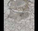 Вся улица в ямах.
