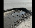 Г.Батайск. Огромная яма на повороте по ул.Ленинградская 250 (рядом с остановкой), ночью и во время дождя её не видно, но если туда попадет колесо, то машине кранты !