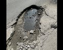 Г.Батайск. Огромная яма на повороте по ул.Ленинградская 250 (рядом с остановкой), ночью и во время дождя её не видно, но если туда попадет колесо, то машине кранты !