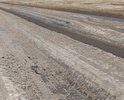Почти месяц такая колея, поворачивать к дому невозможно, приходиться ехать до ближайшего перекрестка что бы развернуться и заехать домой, была оттепель можно было грейдером сравнять это дело но нет, грейдер проехал по по обочине и то когда опять все это примерзло.Как то так вот!!! Спасибо за внимание!